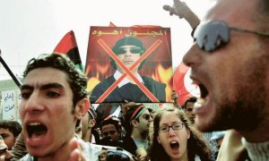 Libyan protesters demonstrating against Muammar al-Qaddafi