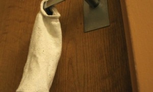 A sock on the door: the classic symbol of the sexile. Photo from web.