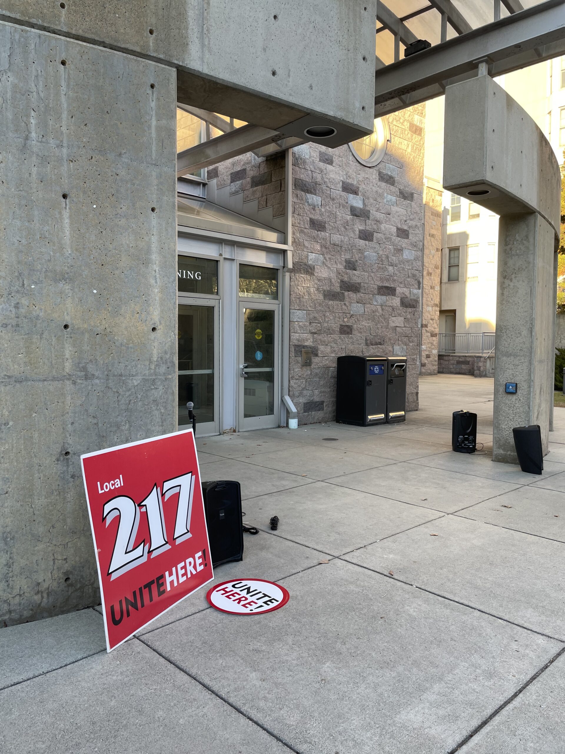 Local 217 "Unite Here" signs sit near the entrance to Harris Dining Hall.